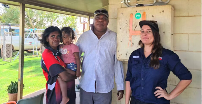 Original-Power Warumungu Elder Frank Jupurrurla (centre), with family members Serena and Nina-Simone (left) and Lauren Mellor (Original Power) (First Nations solar)