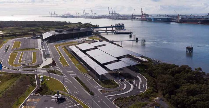 Aerial photo of solar system on roof of Port of Brisbane offices with Brisbane River and port in background